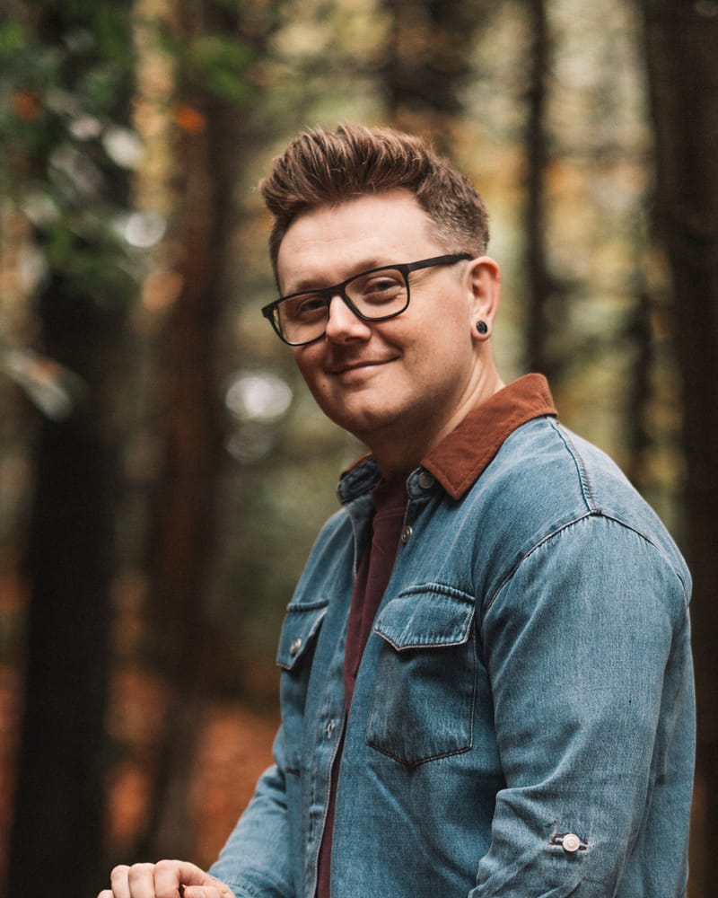Adam smiling, portrait in an autumn wood