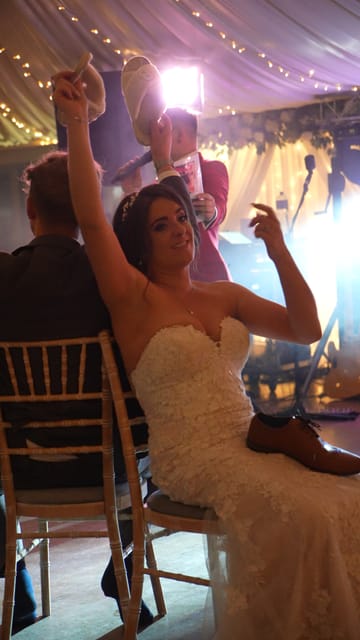 A bride with her arm in the air