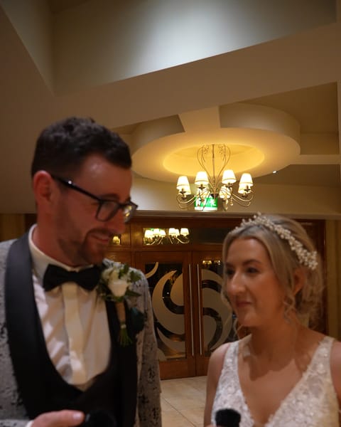 A bride and groom smiling at An Grianan Hotel