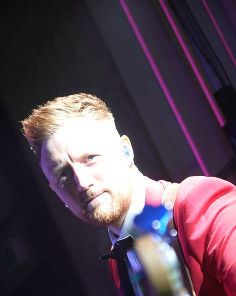 The bass player smiling at the Dunadry Hotel