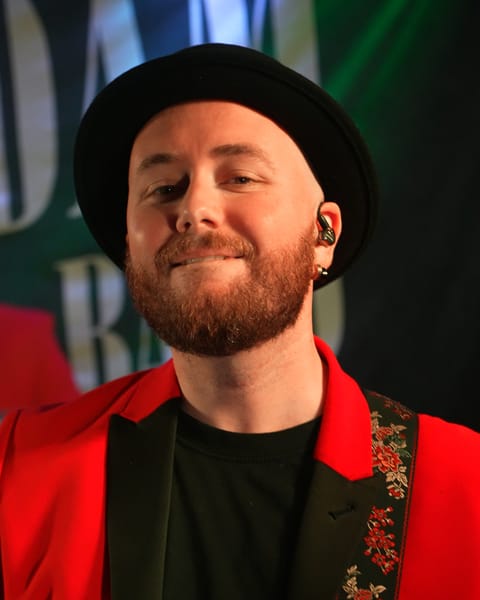 The guitarist smiling on stage at Galgorm