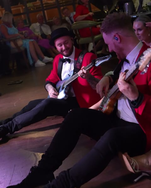 The band playing among the guests at The Rabbit Hotel