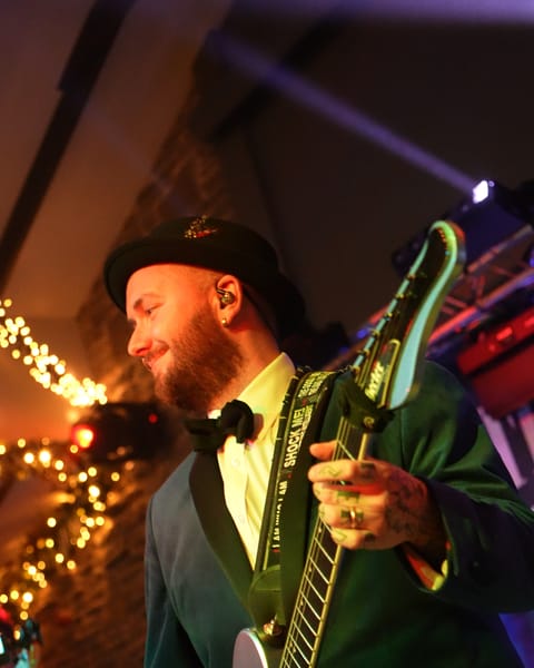 The guitarist under the fairy lights at Segrave Barns